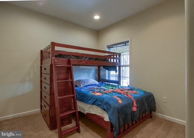 carpeted bedroom featuring recessed lighting and baseboards