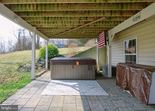 view of patio / terrace with a hot tub