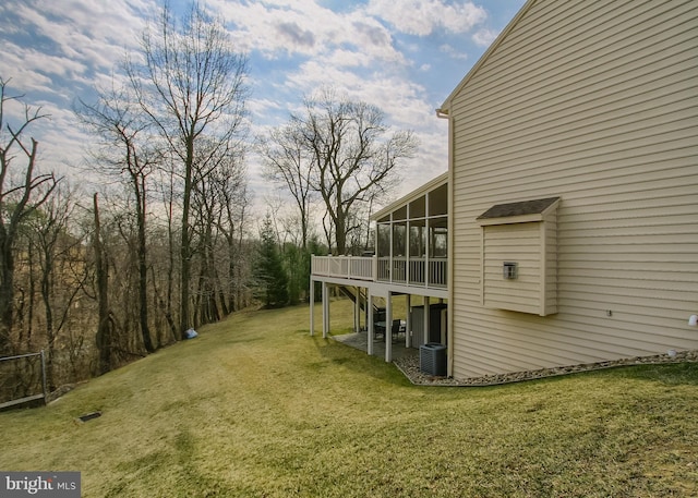 view of yard with cooling unit and a sunroom