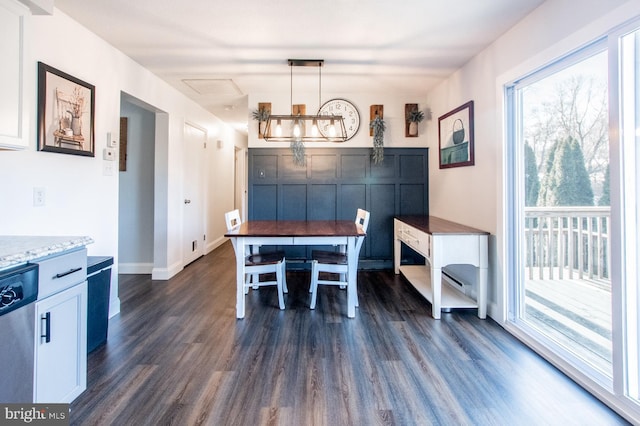 dining space with dark hardwood / wood-style flooring