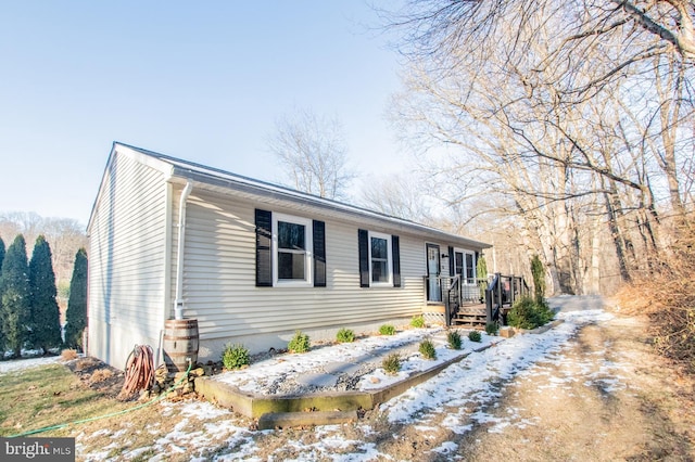 view of front of home with a wooden deck