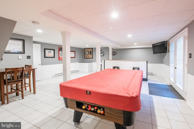 game room featuring a paneled ceiling, billiards, and a baseboard heating unit