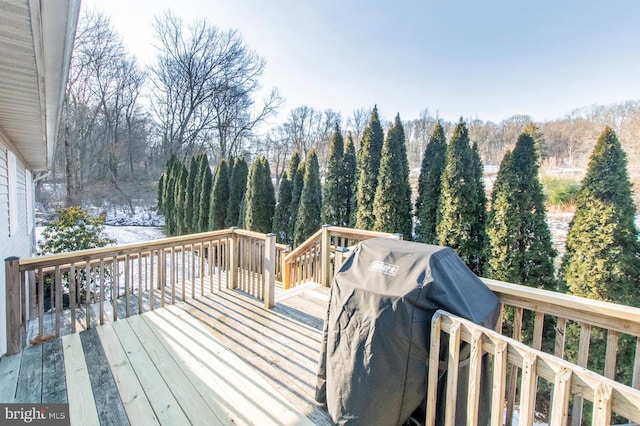 wooden deck featuring grilling area