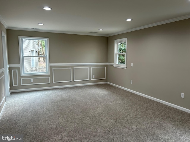 unfurnished room featuring carpet floors and ornamental molding