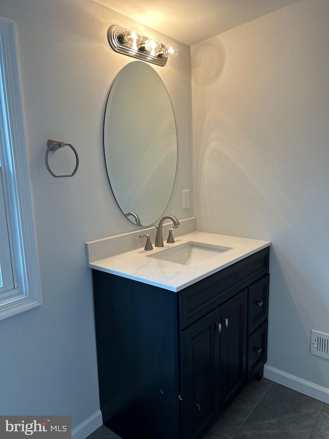 bathroom featuring vanity and tile patterned flooring