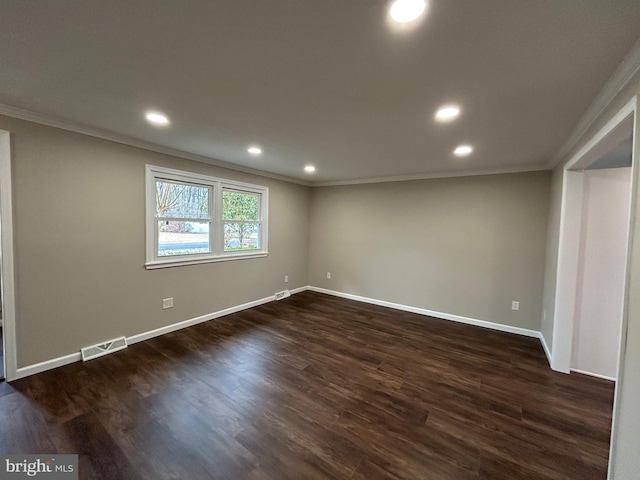 unfurnished room featuring dark wood-type flooring and ornamental molding