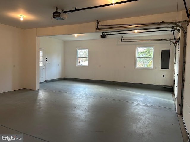 garage featuring a garage door opener and electric panel