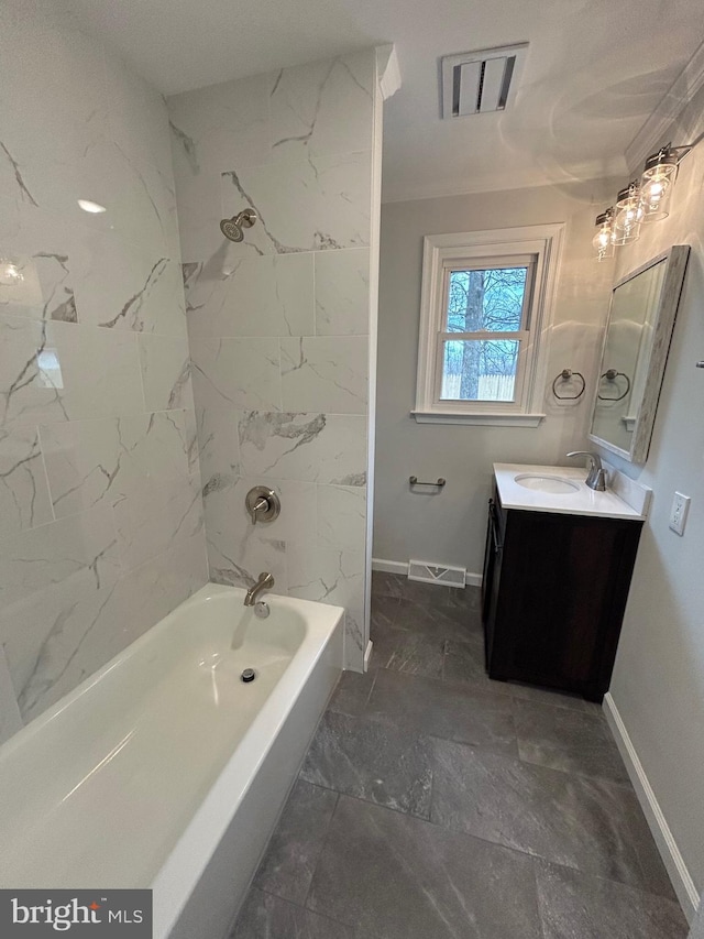 bathroom with tiled shower / bath combo, crown molding, and vanity