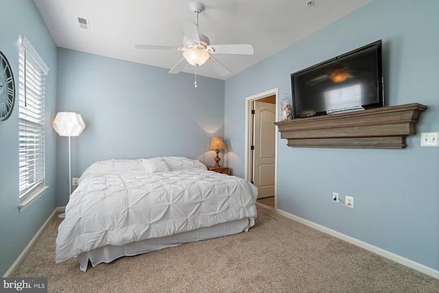 bedroom featuring light carpet and ceiling fan