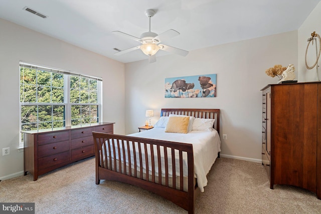 bedroom with ceiling fan and light colored carpet