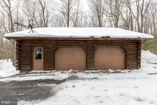 view of snow covered garage