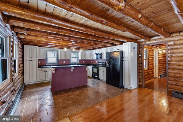 kitchen featuring black appliances, white cabinetry, and rustic walls