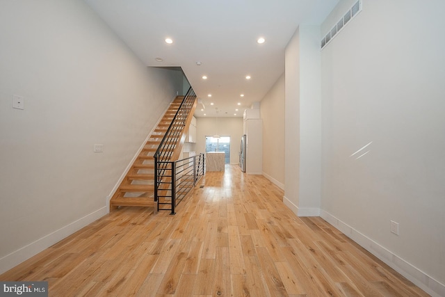 corridor featuring light wood-type flooring