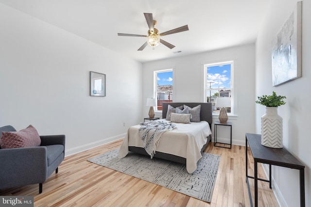 bedroom featuring ceiling fan and light hardwood / wood-style floors