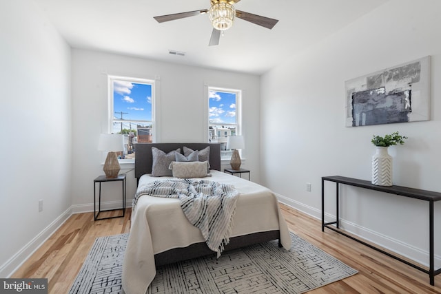 bedroom featuring ceiling fan and light wood-type flooring