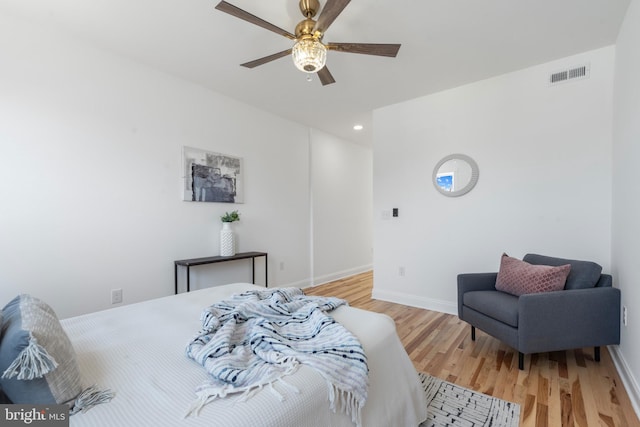 bedroom featuring hardwood / wood-style flooring and ceiling fan