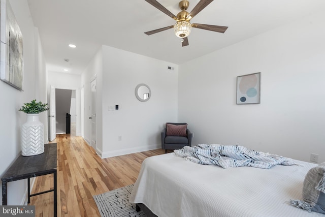 bedroom featuring ceiling fan and hardwood / wood-style flooring