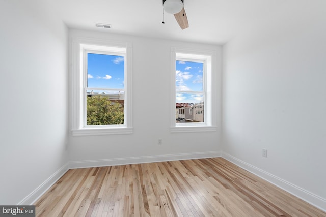 unfurnished room featuring ceiling fan and light hardwood / wood-style floors