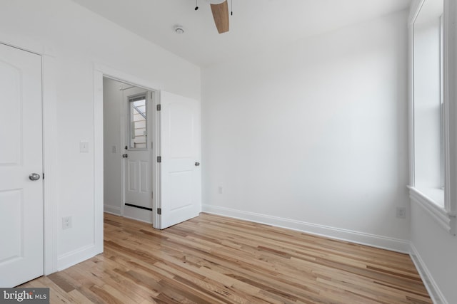 spare room featuring ceiling fan and light hardwood / wood-style floors