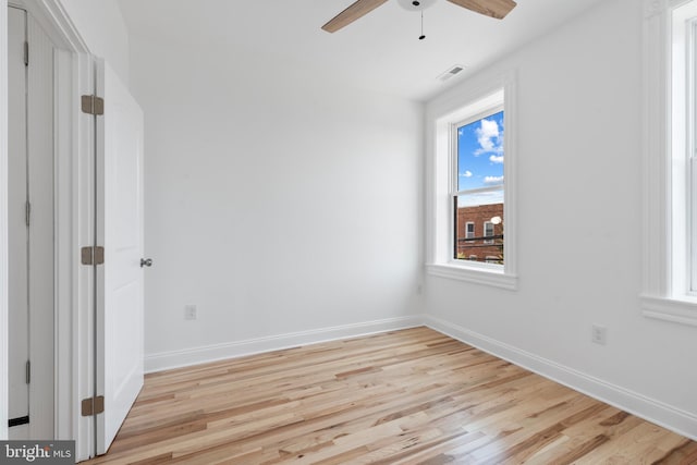 spare room with light hardwood / wood-style floors and ceiling fan