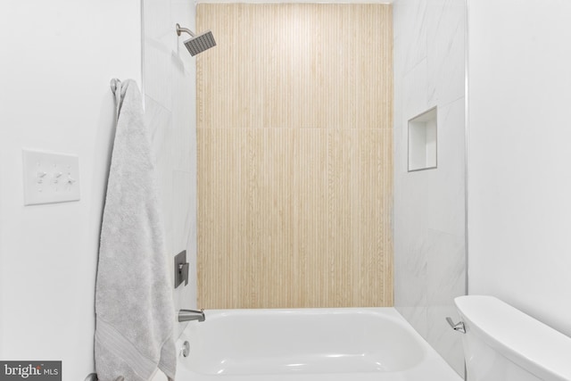 bathroom featuring  shower combination and toilet