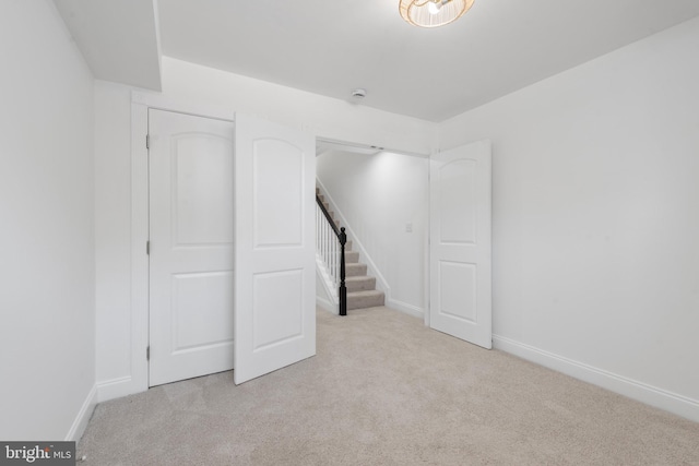 unfurnished bedroom with light carpet