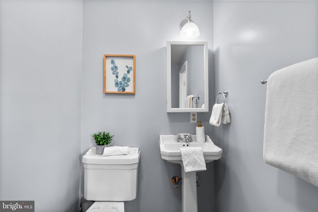 bathroom with sink and toilet