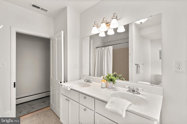 bathroom featuring a baseboard radiator, vanity, curtained shower, and tile patterned flooring