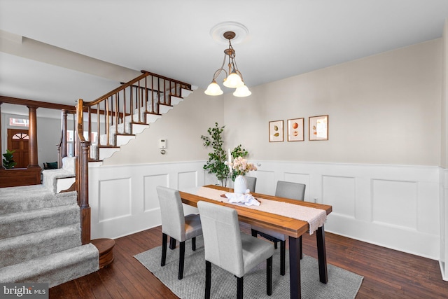 dining room featuring dark hardwood / wood-style floors and a chandelier