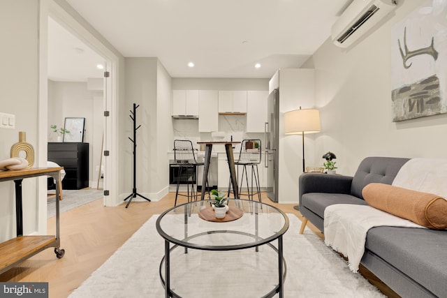 living room with light parquet flooring and a wall mounted air conditioner