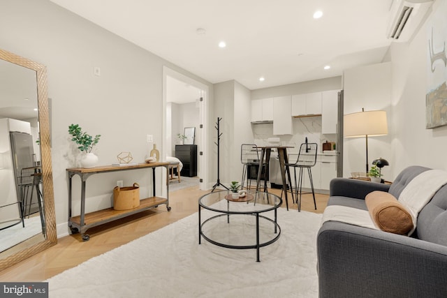 living room featuring light parquet floors and a wall unit AC