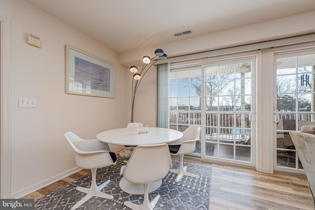 dining area with light wood-type flooring