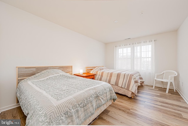 bedroom with light hardwood / wood-style floors