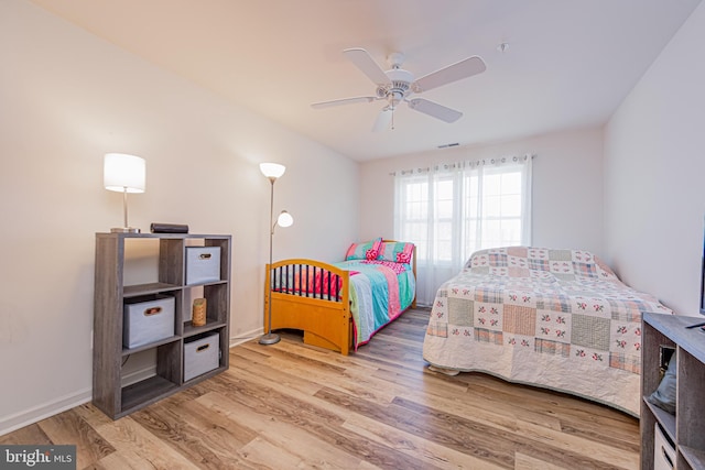 bedroom featuring hardwood / wood-style flooring and ceiling fan