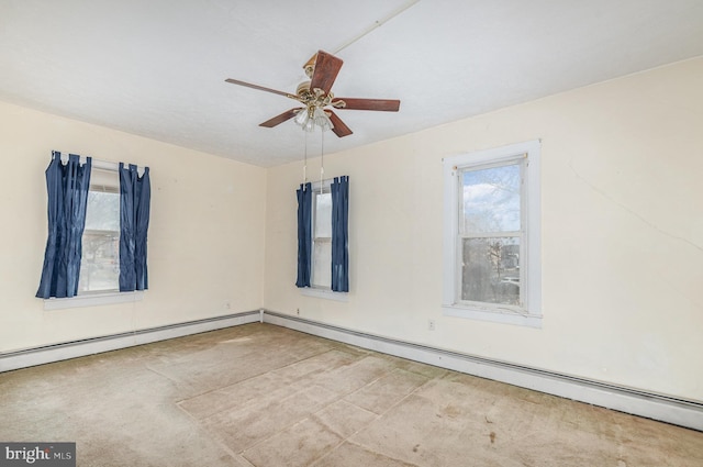 unfurnished room with a ceiling fan, a healthy amount of sunlight, baseboard heating, and carpet floors