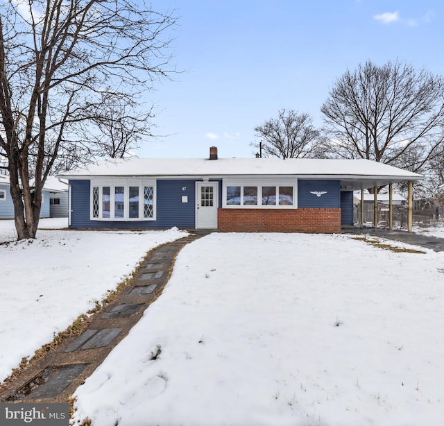 view of front of home with a carport