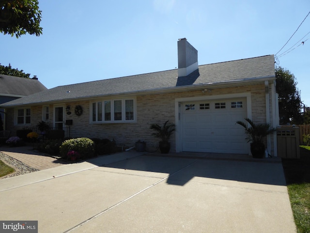 ranch-style house featuring a garage