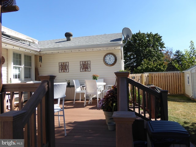 deck with a storage shed