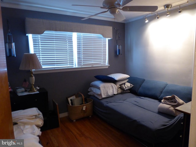 bedroom with hardwood / wood-style flooring and ceiling fan