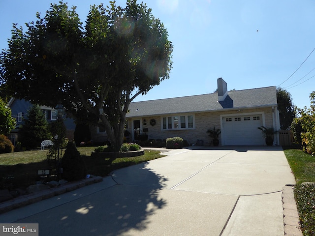 ranch-style house featuring a garage