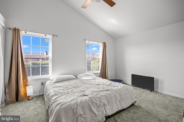 carpeted bedroom with high vaulted ceiling and ceiling fan