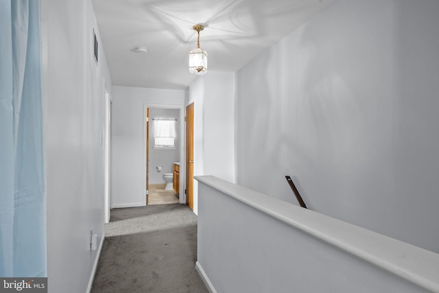 hallway featuring carpet flooring