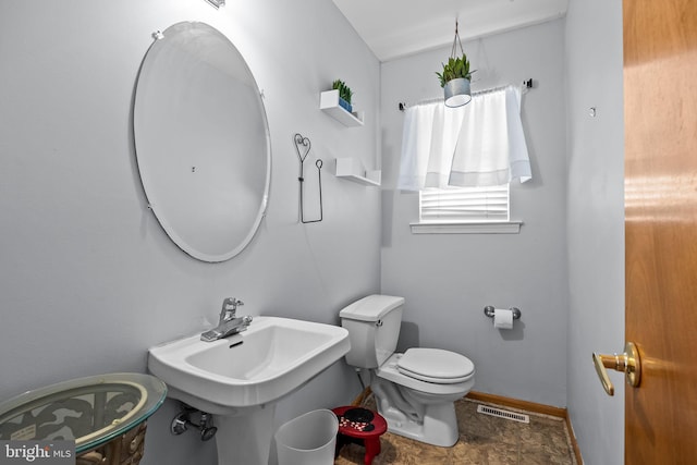 bathroom with toilet and sink