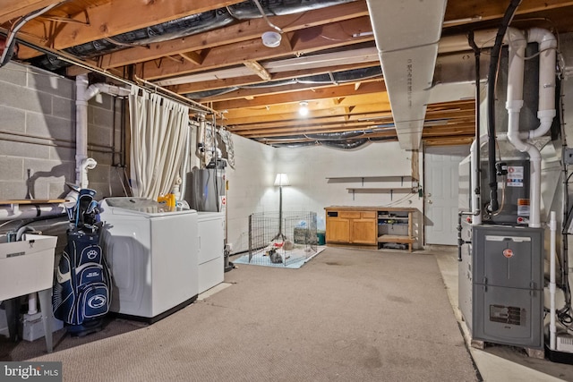 basement with separate washer and dryer and heating unit