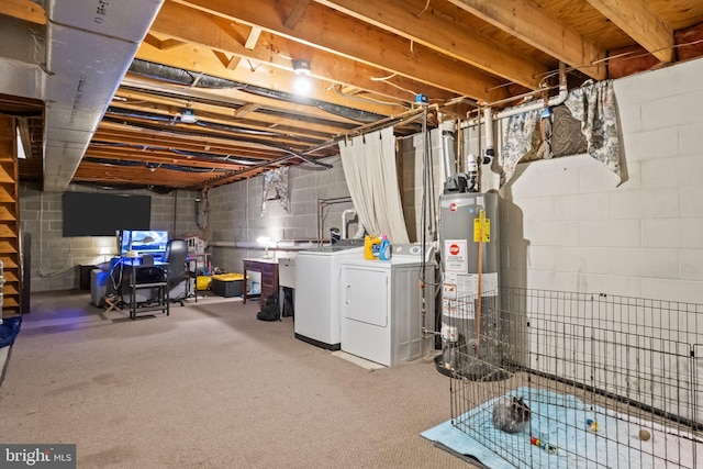 basement featuring washing machine and clothes dryer and gas water heater