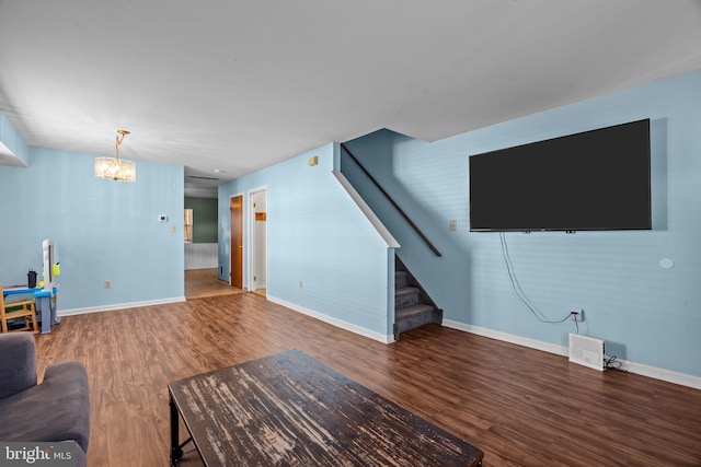 living room featuring hardwood / wood-style floors and an inviting chandelier