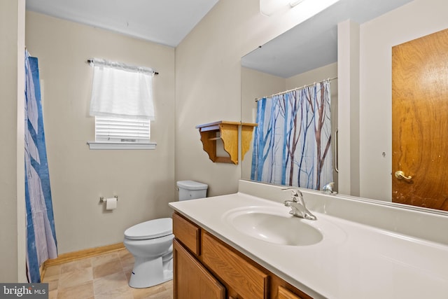 bathroom with toilet and vanity