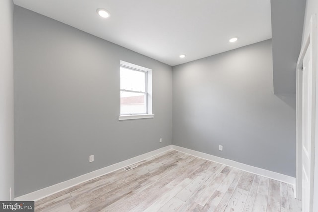 spare room with light wood-type flooring