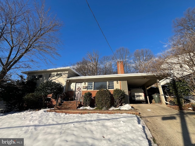 view of front of home with a carport