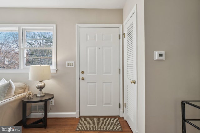 foyer entrance with dark hardwood / wood-style flooring